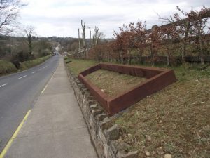 Flowers boxes being put in place on the roadside to the GAA field as part of the Tidy Towns Village improvement scheme  