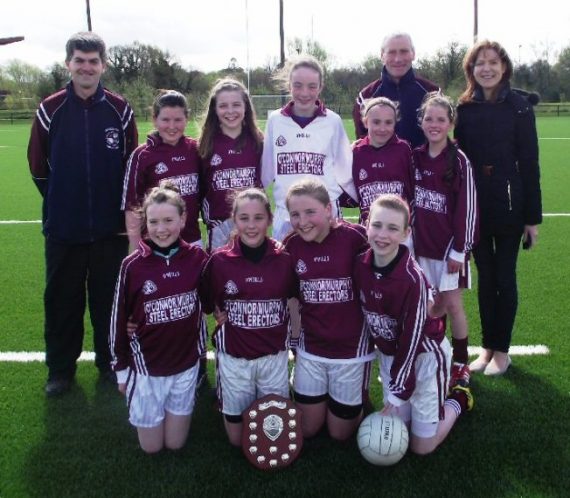 Athea N.S. Girls football team with their coaches David O'Connor and John Hunt and their teacher Miss  Prendeville after winning the Mini Sevens County final in UL last Thursday  