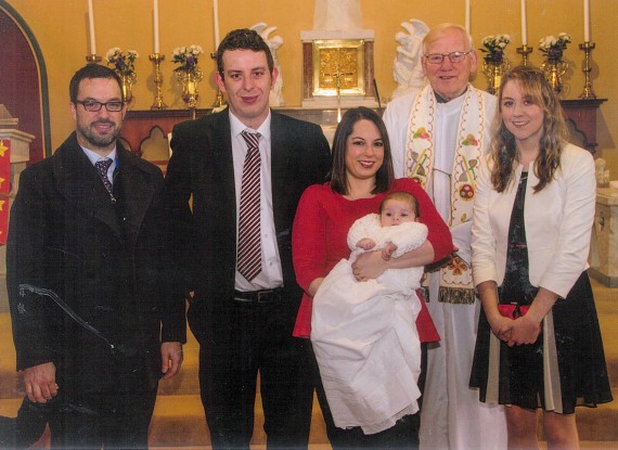 Pictured at the christening of baby Tom Finucane are parents Alma and J.P. Finucane, godparents Owen O’Connor, uncle and Rebecca O’Connor, cousin with Fr. Bowen PP who administered the Sacrament 