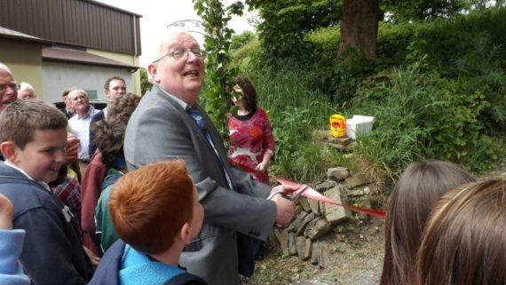 Chairman Lal Browne cuts the ribbon  to launch the ‘Fairy Mountain’ 