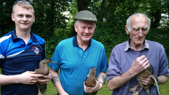 Raymond Brouder, Jerry Brouder and  Seán Fitzgerald with some of the ducks that were put in the river by the Gun Club 