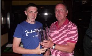 Sean Ryan receiving his prize for winning the competition in Castleisland on Saturday last from Athea Golf Society Captain, Noel Barry
