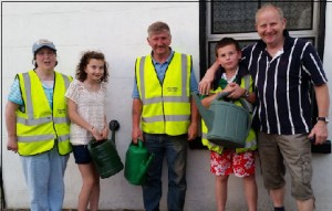 Local Tidy Towns volunteers busy keeping the flowers watered 