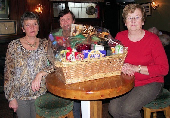 Patsy Hayes, Mag O’Connor & Maireád Langan looking after the spot prizes at the Going Strong Christmas Party