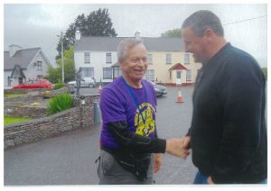 Joe Aherne from Glenagore being congratulated for completing the JFK 50 mile challenge walk in Sneem recently 