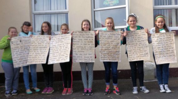 Pupils from Athea National School holding the present day Proclamation which they composed for 2016