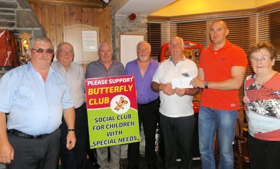 Athea Vintage Committee who made a presentation of €1,000 to the Butterfly Club, proceeds of the Vintage Run held in Athea recently, at Brown Joe's, Athea on Saturday night last. L. to R.: Francie Flavin, Patrick Langan, Johnny Kelly, Jimmy Kelly, James O'Connor, Colm Leahy and Mairéad Langan. 